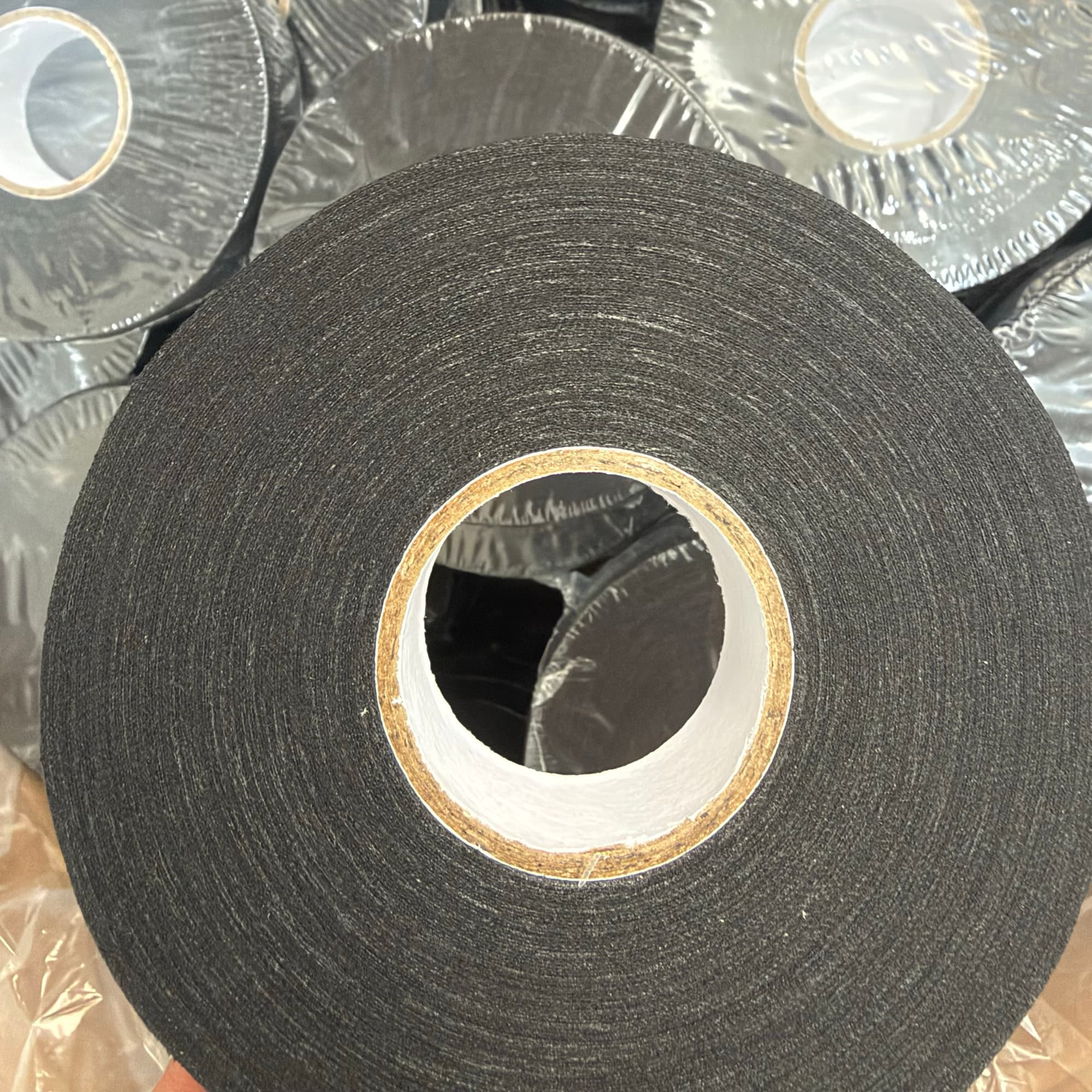 Black waxed cotton cloth hockey tape, 25mm × 25m roll